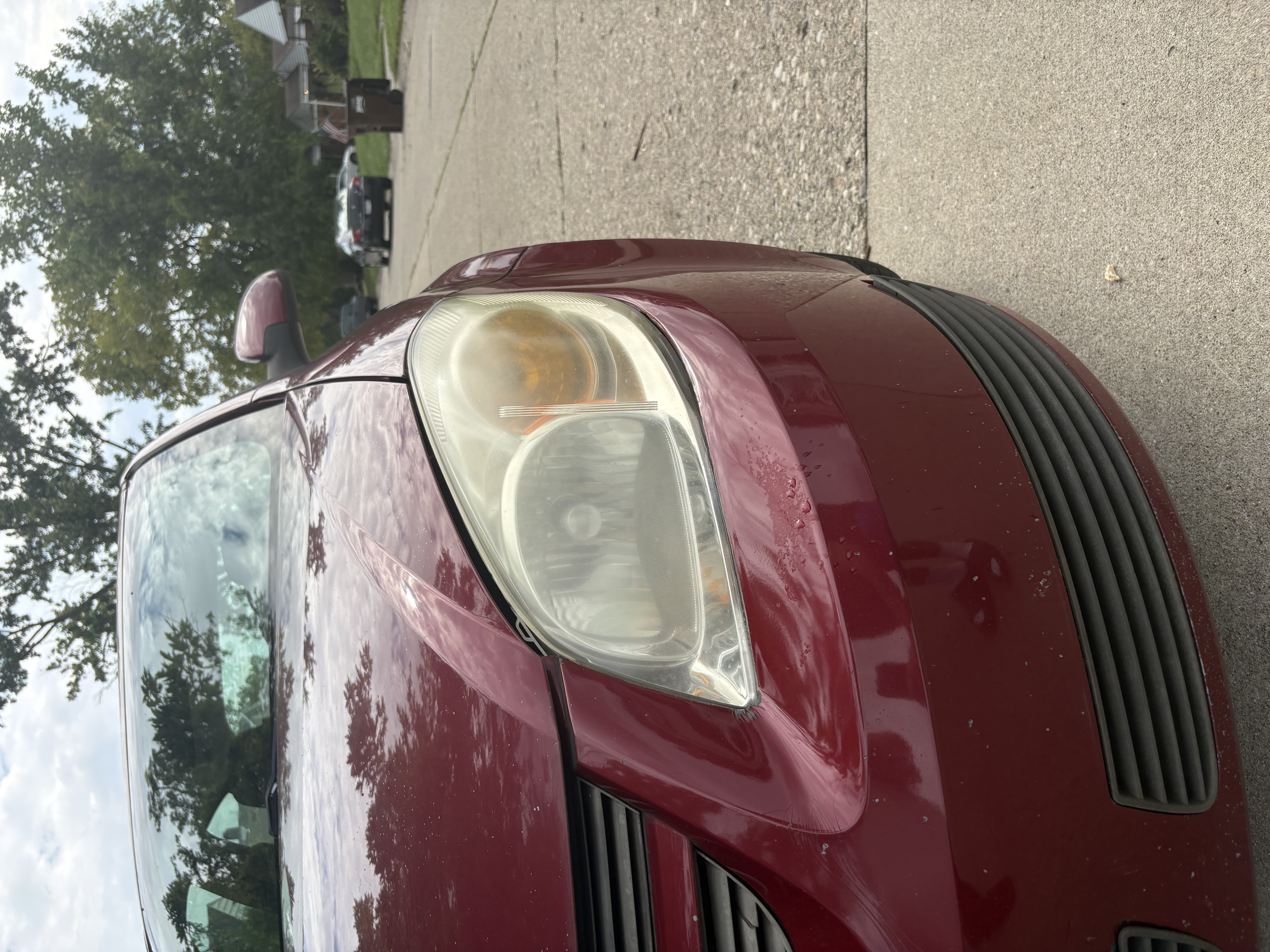 Hazy, oxidized headlight lens before restoration
