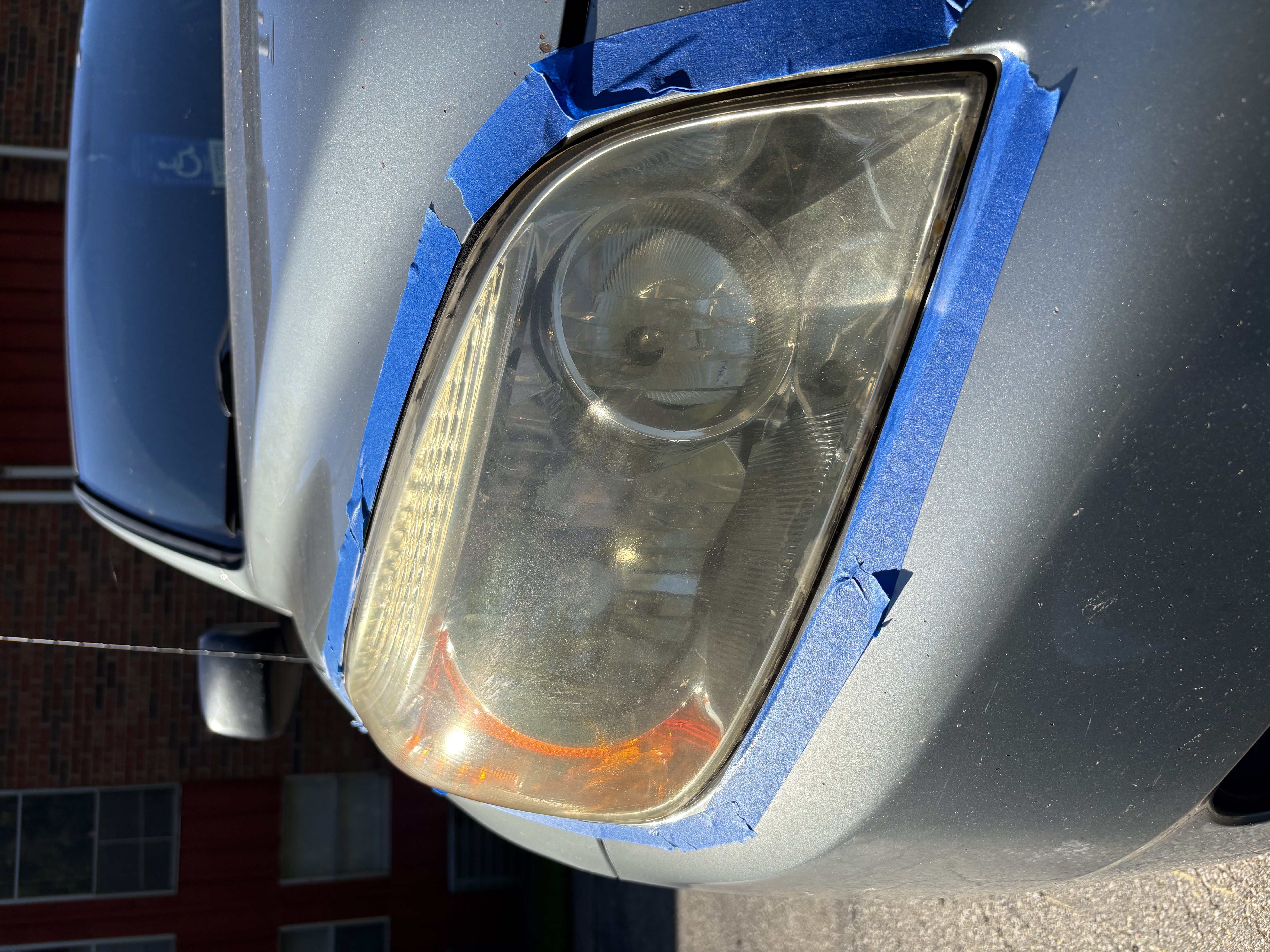 Hazy, oxidized headlight lens before restoration