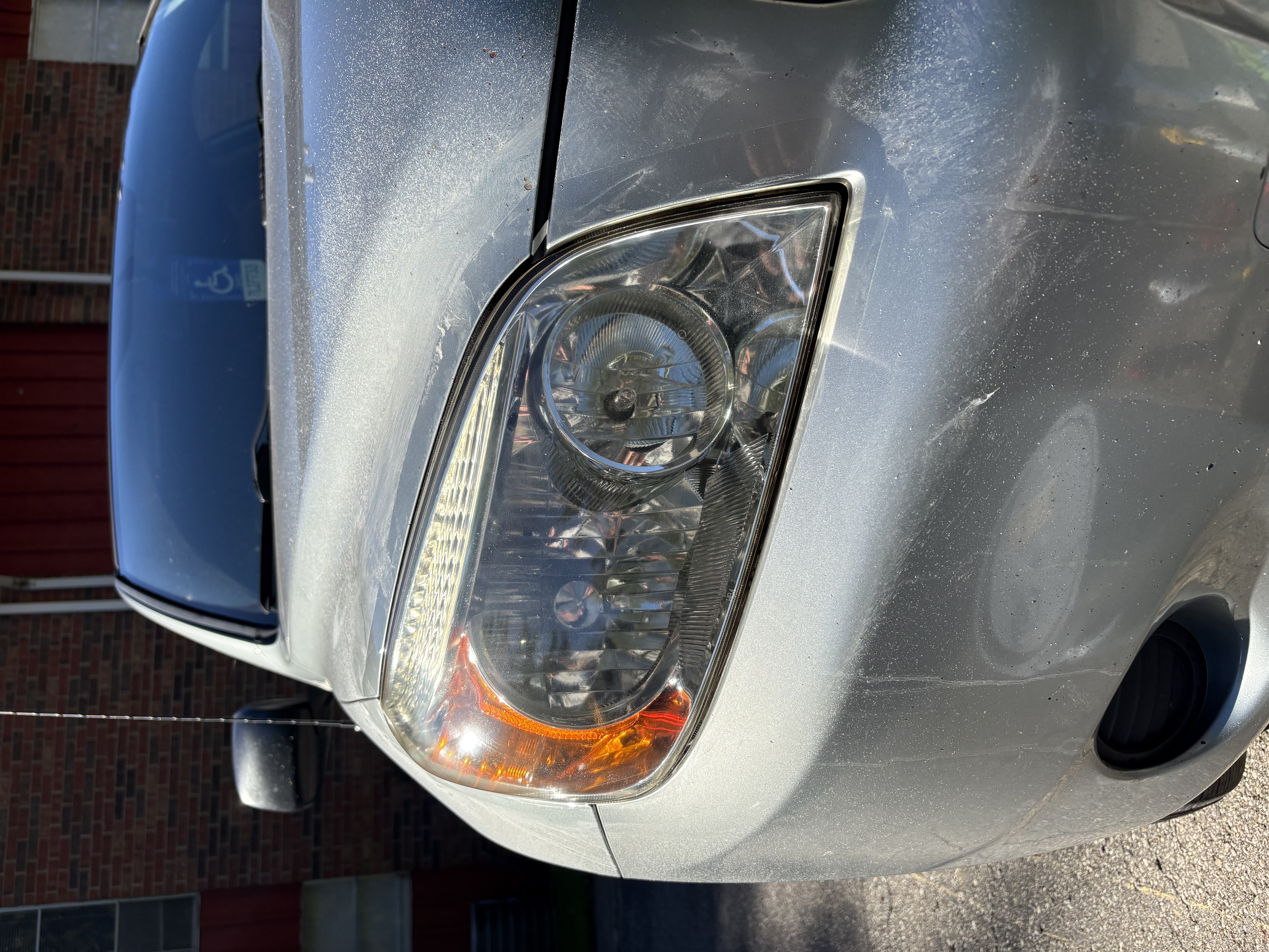 Clear, restored headlight lens after restoration
